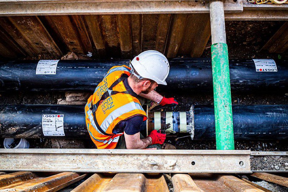 Man turning pipe